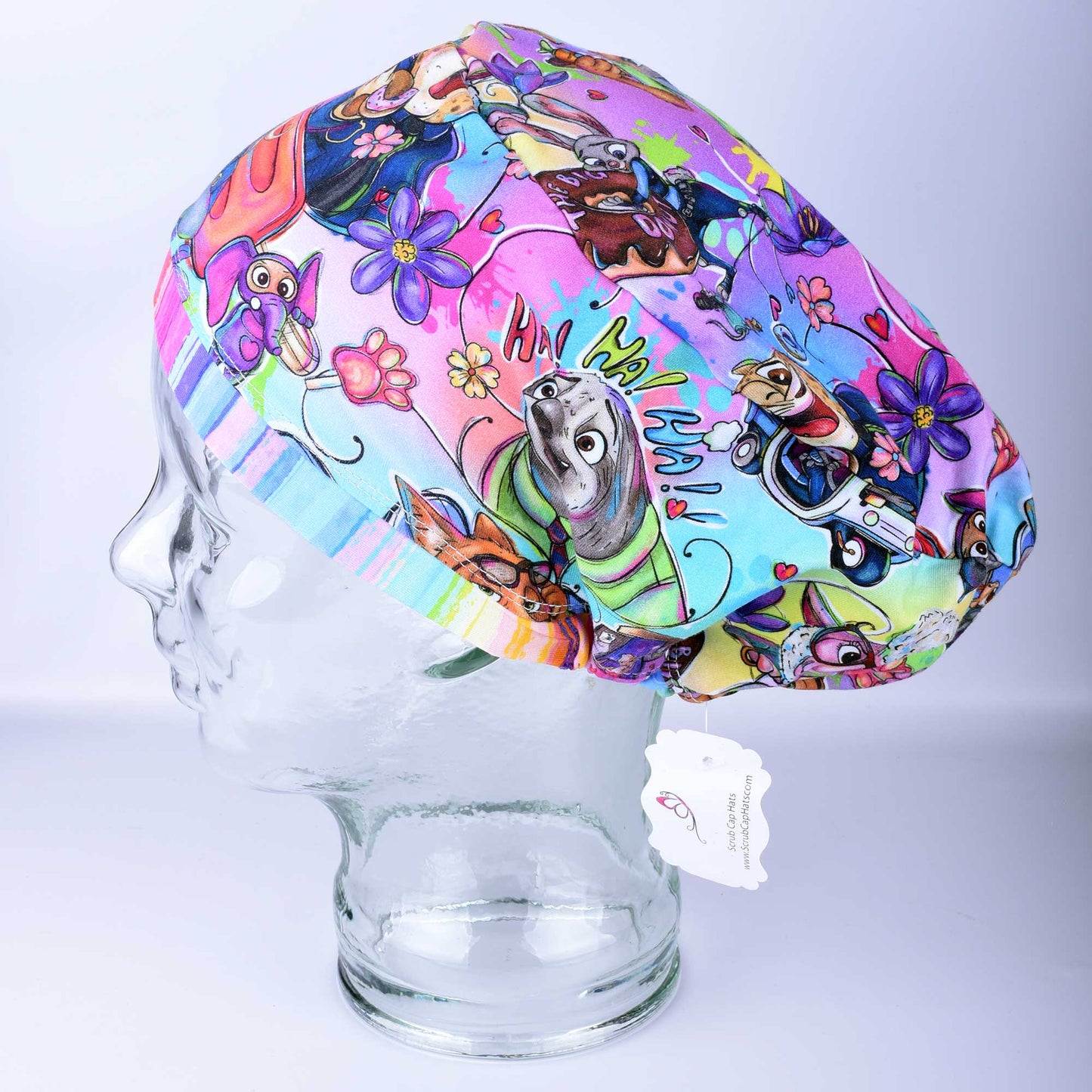 Full coverage scrub cap featuring a "Zoo Friends" pattern with colorful, hand-drawn rabbits, sloths, lions, and sheep on a white background. Includes an adjustable cord lock for a secure fit.