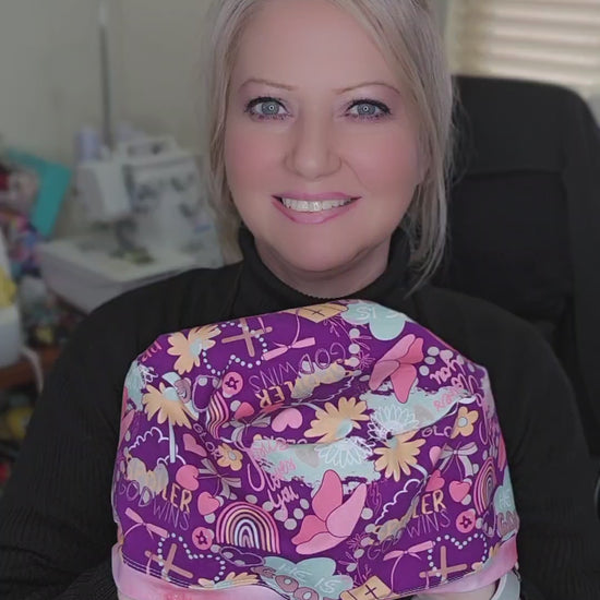 A short video demonstration showing the 360-degree view of the Christian faith scrub cap, highlighting the stretch of the fabric and how to adjust the toggle for a no-slip fit.