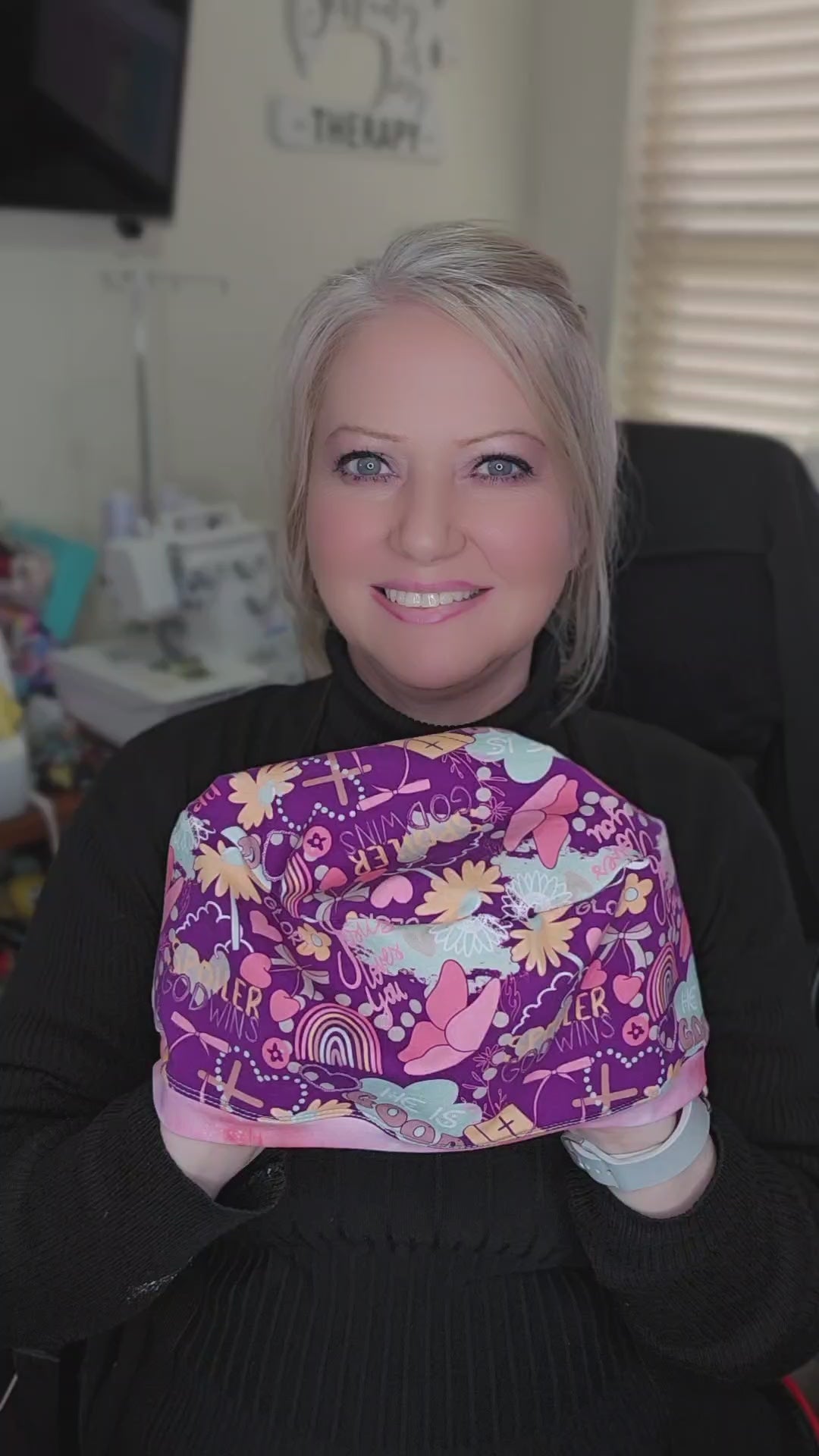 A short video demonstration showing the 360-degree view of the Christian faith scrub cap, highlighting the stretch of the fabric and how to adjust the toggle for a no-slip fit.