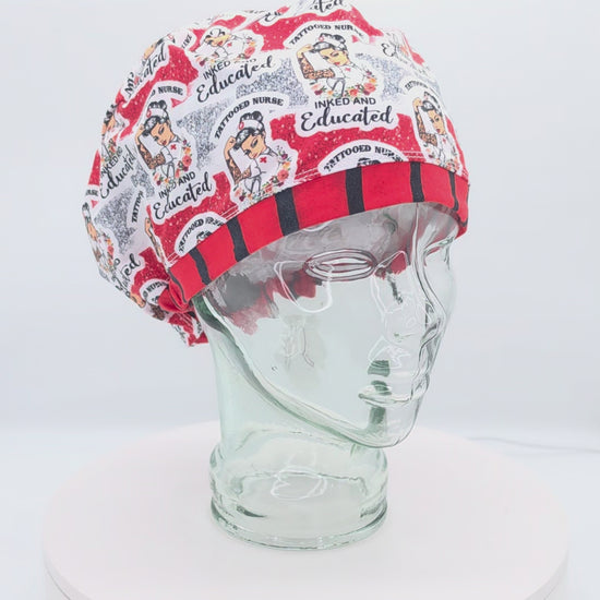 A 360-degree rotating view of a white mannequin head wearing the Tattoo Nurse Full Coverage Scrub Cap. The cap features a vibrant traditional tattoo flash art pattern with text reading 'Inked and Educated' and 'Tattooed Nurse,' finished with a bold red and black striped brim.
