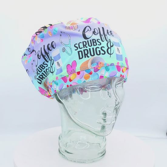 360-degree rotating video of the Coffee Scrubs Drugs Euro-style scrub cap on a clear mannequin head, displaying the pastel medical print, adjustable fit, and full coverage design.