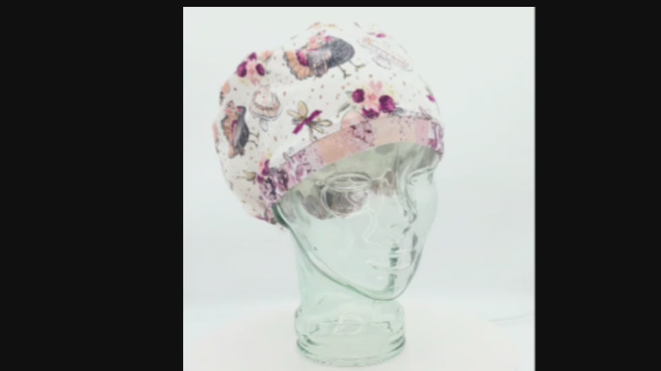 Short video showing a 360-degree view and adjustable fit of a Thanksgiving Turkey Feast themed Euro-style scrub cap on a display model.